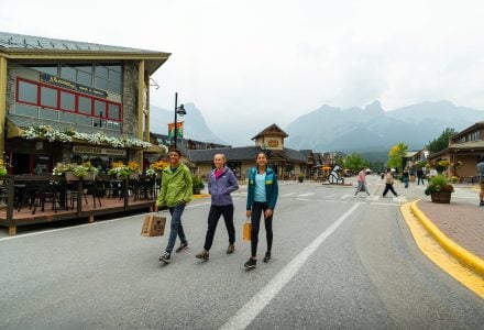 a family shopping on Main Street in downtown Canmore