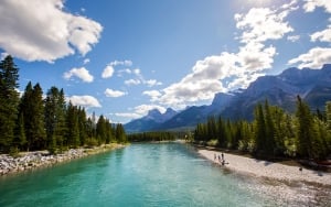 river with mountains in the background