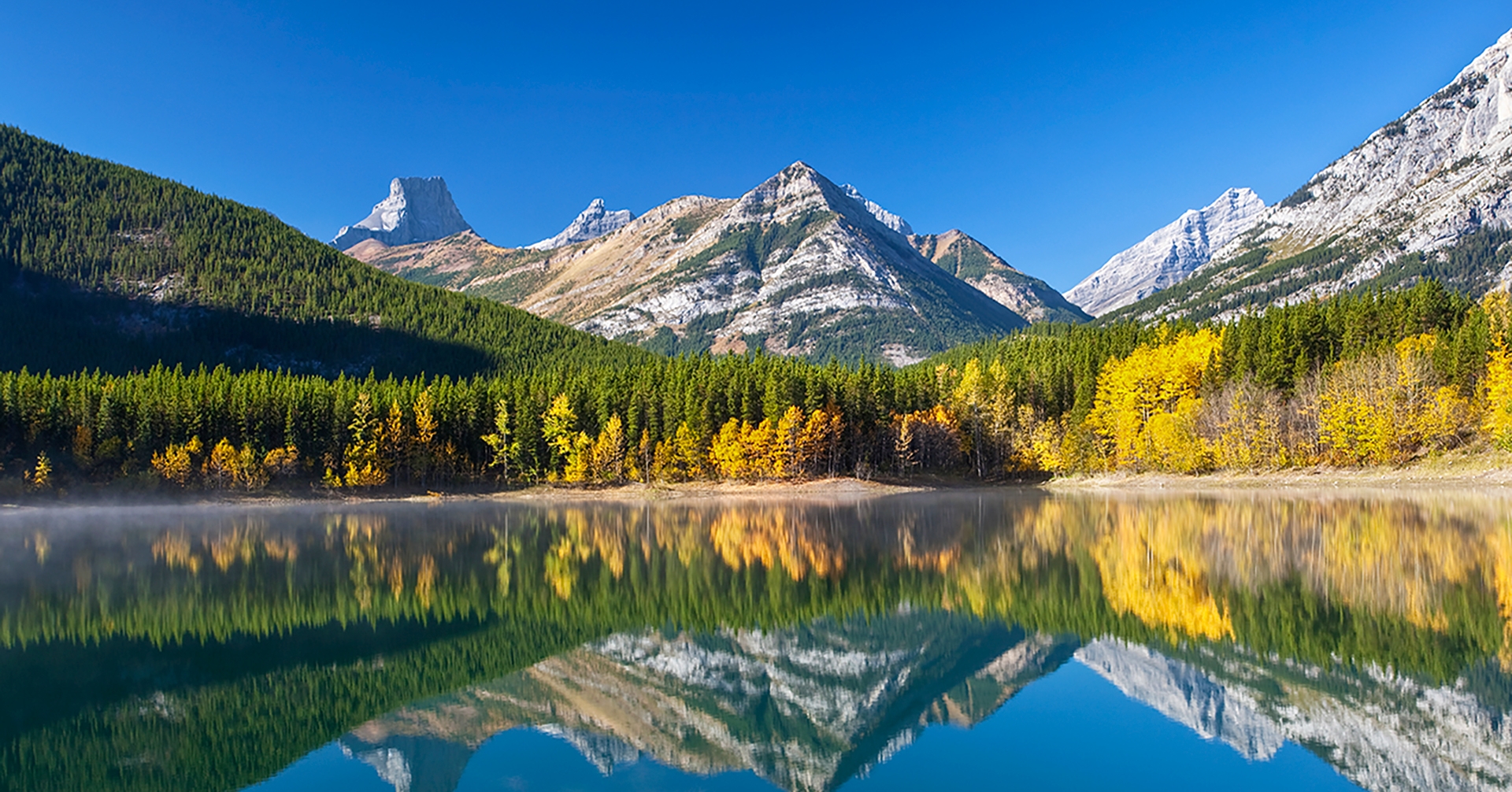 lake with mountain in the background