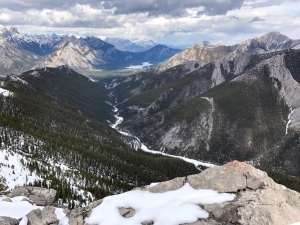 Stunning aerial view from a snowcapped mountain with valley below