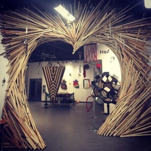 A wooden archway sculpture at artsPlace Canmore