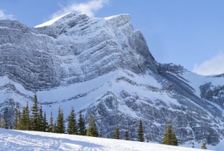 two people fat biking at the canmore nordic centre in the winter