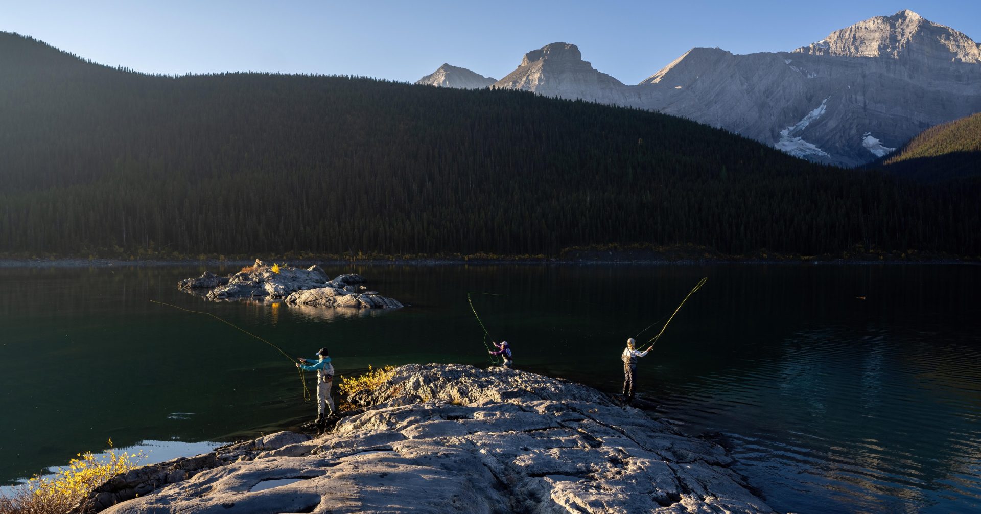 two people fishing at Kananaskis Lakes