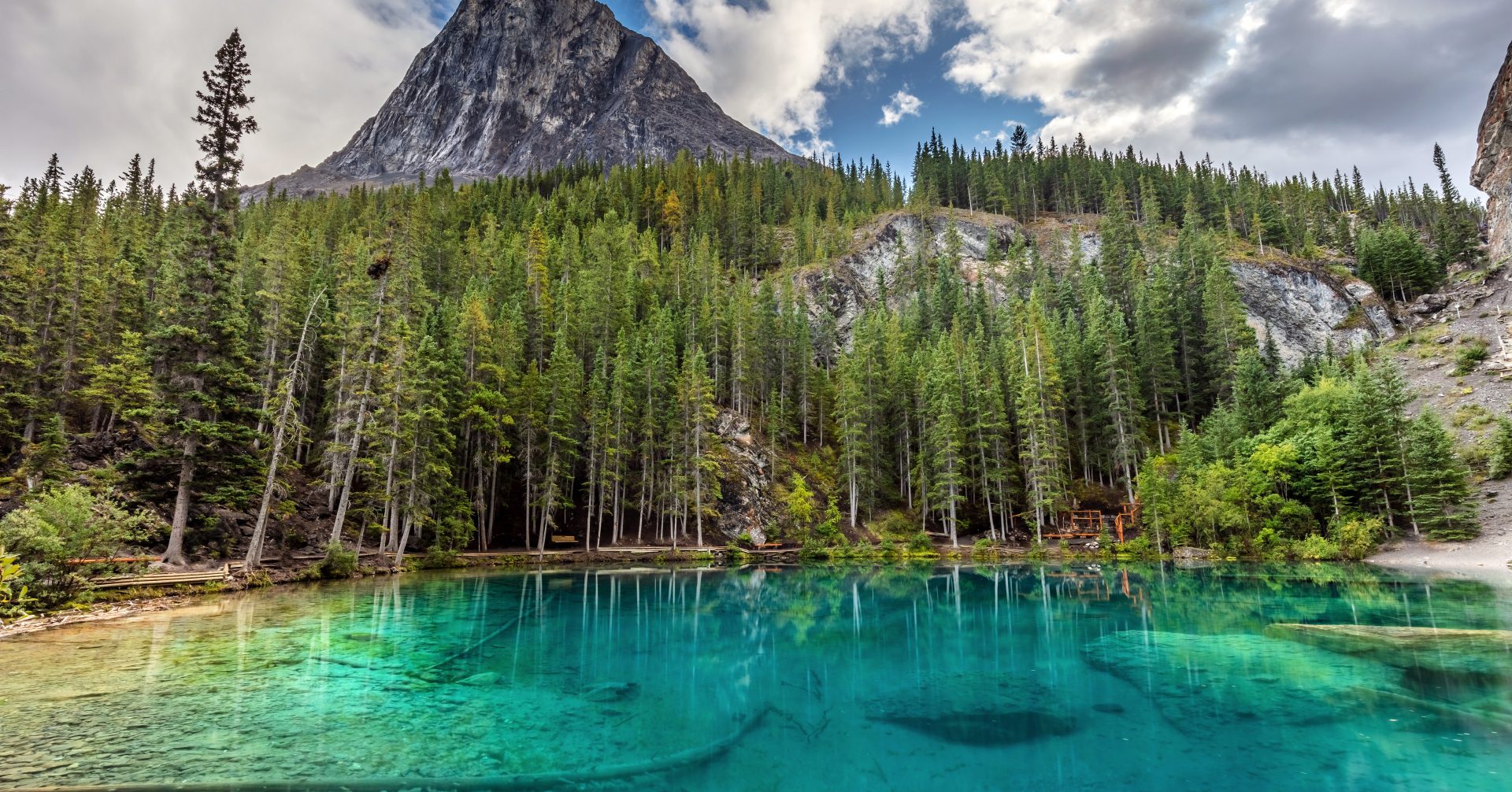 gorgeous green grassi lake in the summer with ha ling in the background