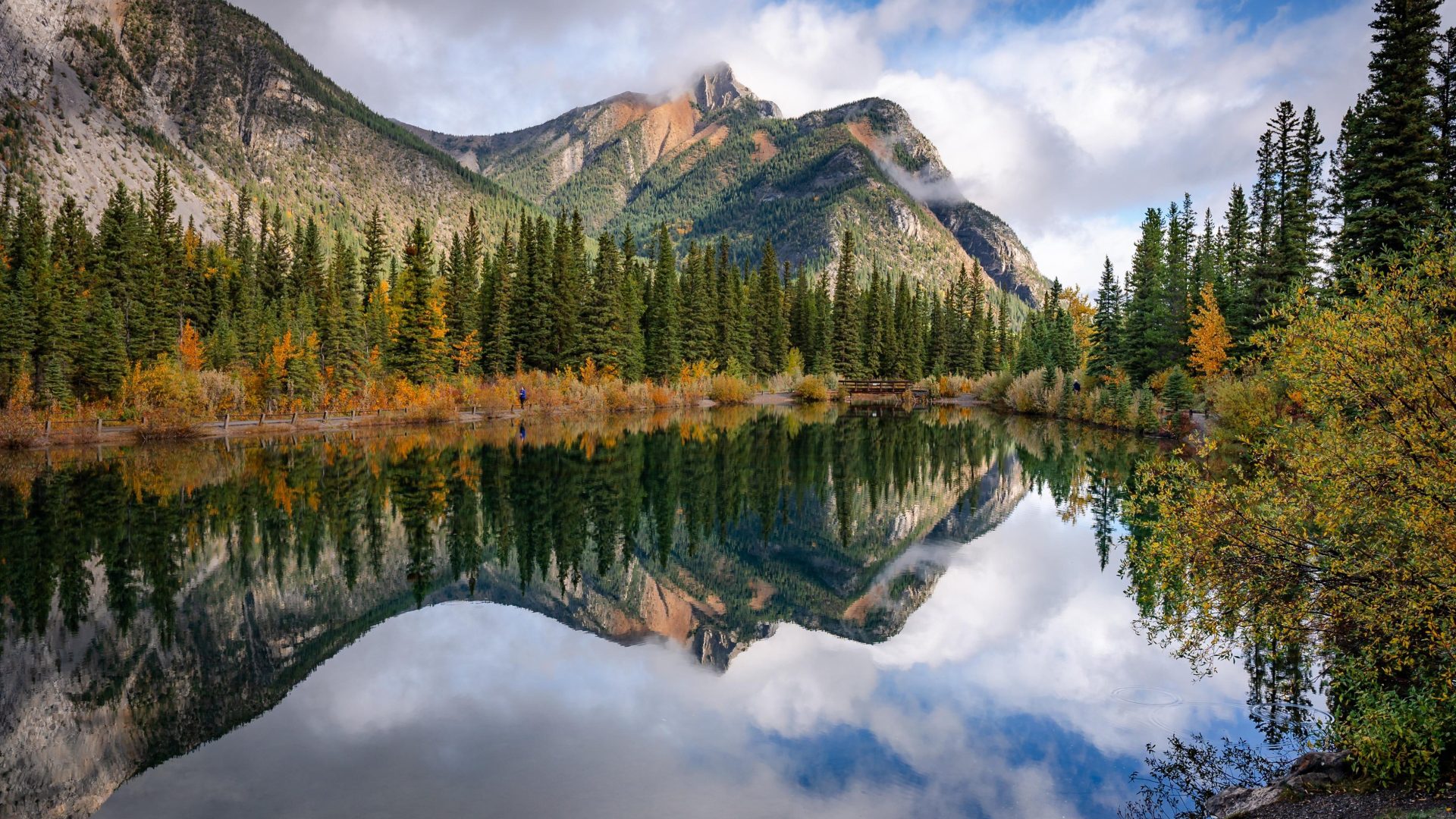 a reflection of mount lorette in mount lorette ponds in the fall