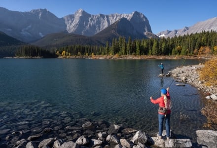 two women fishing at kananaskis lakes in the fall