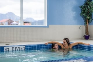 a mother and daughter in the hot tub of the Stoney Nakoda Resort