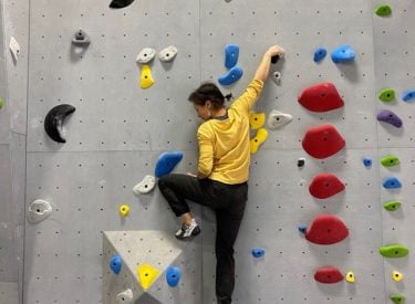 a person on an indoor climbing wall