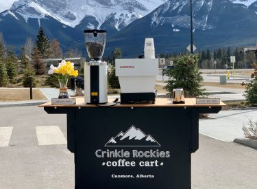 crinkle rockies coffee cart outdoors with the three sisters mountain in the background