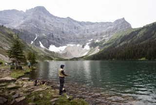 a man fishing at Rawson Lake in kananaskis