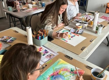 People painting at a Listen Studio workshop