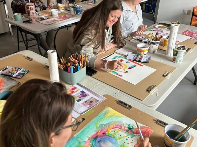 People painting at a Listen Studio workshop