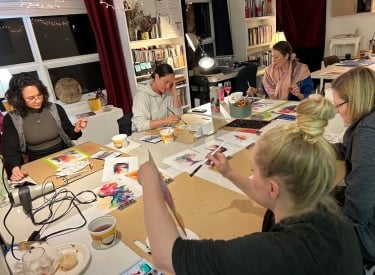 People painting at a Listen Studio workshop